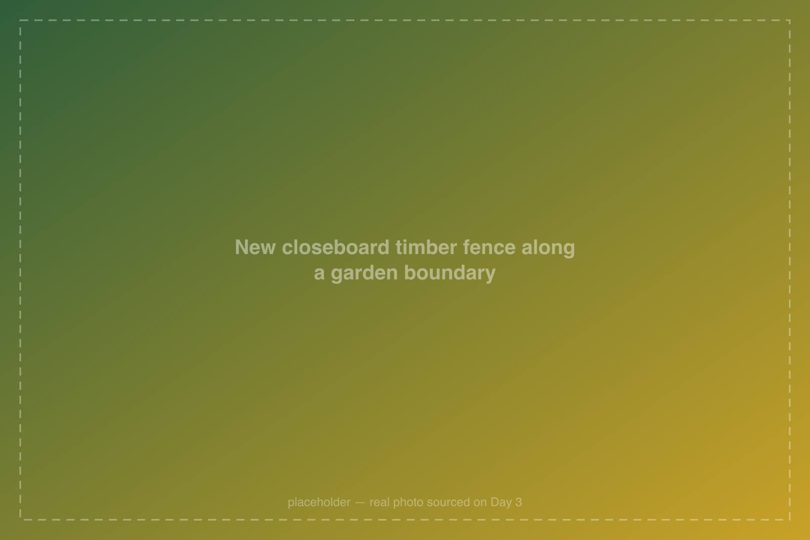 New closeboard timber fence along a garden boundary